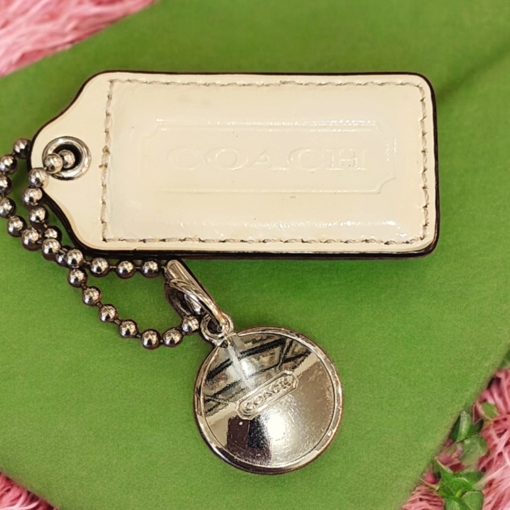 COACH Off White Leather RepTag Charm w Silver Coach Coin Charm